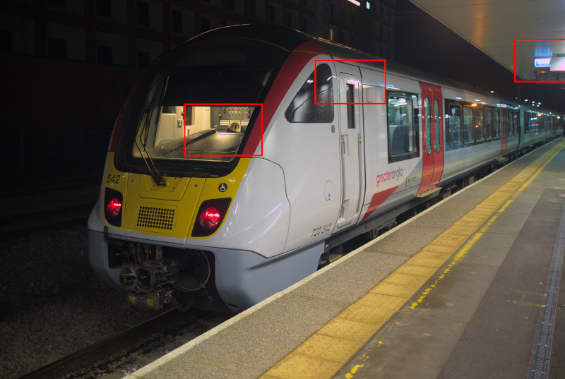 Photo of a class 720 at Cambridge North with some highlights indicated in red boxes.