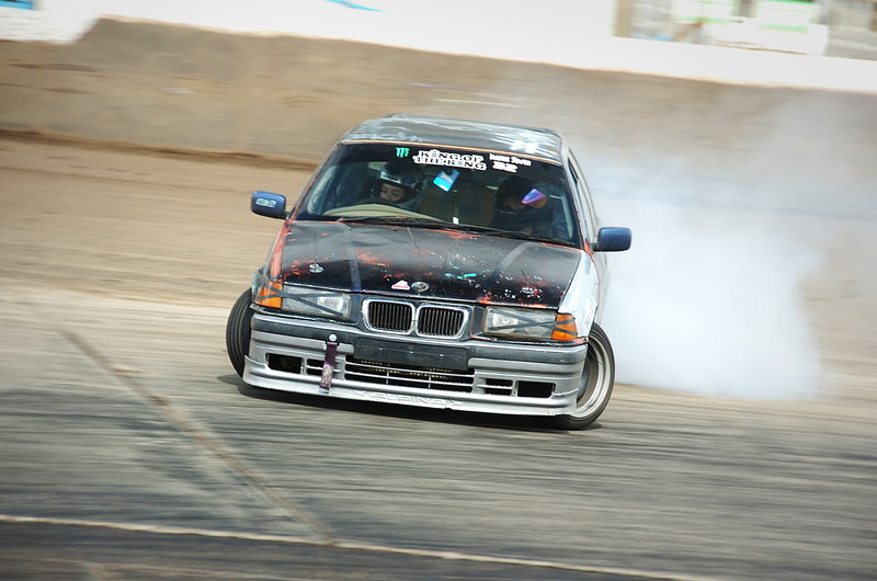 Abby Hannen drifting her E36 Touring at the Adrian Flux Arena
